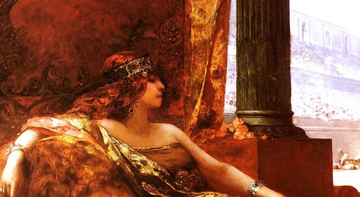 Painting of a crowned, red-haired woman partially reclining on a couch. The painting is very heavy on reds and golds.