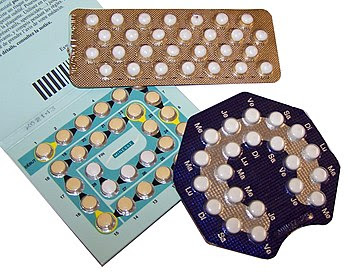 Photograph of different kinds of birth control pills, in rectangular and oval packets